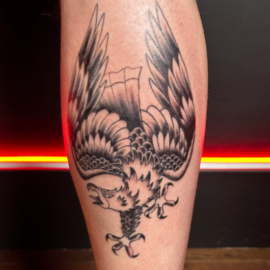 Pic of a traditional eagle leg tattoo.