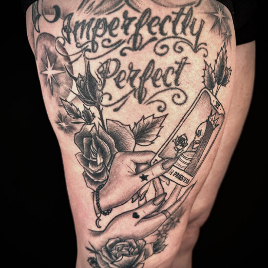 Witchy black and grey thigh tattoo