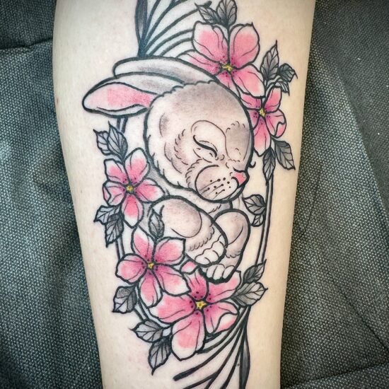 Neo traditional style bunny and flowers tattoo