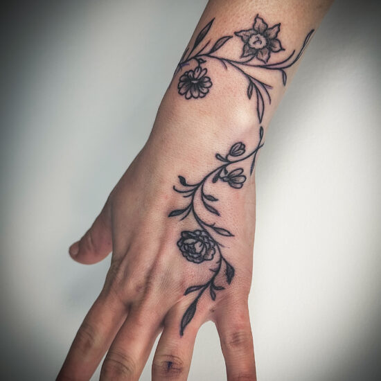 Hand linework vine tattoo