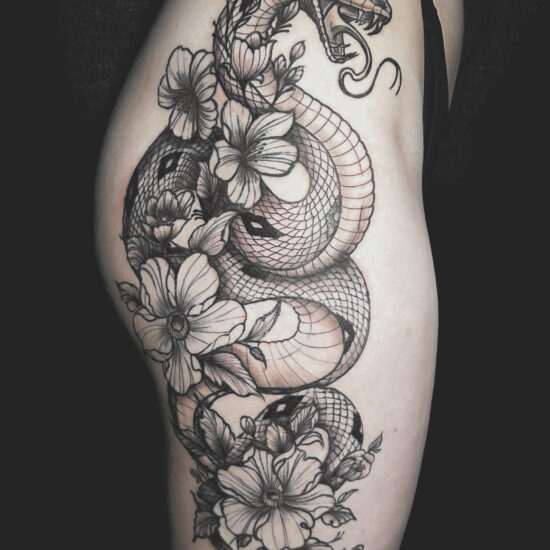 Thigh black and grey tattoo snake and flowers